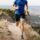 Active man running on a mountain trail after regenerative therapy at Essential Health Bozeman NC.